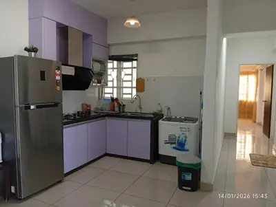 a kitchen with purple cabinets and a stainless steel refrigerator at Seberang Jaya Family Pool Homestay Near Hospital 3 Bedroom Aircond 2 Bathroom & Family Room Aircond in Perai