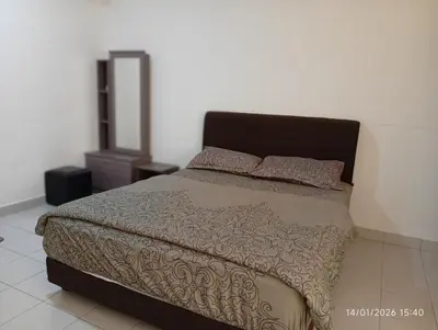 a bedroom with a bed and a dresser in it at Seberang Jaya Family Pool Homestay Near Hospital 3 Bedroom Aircond 2 Bathroom & Family Room Aircond in Perai