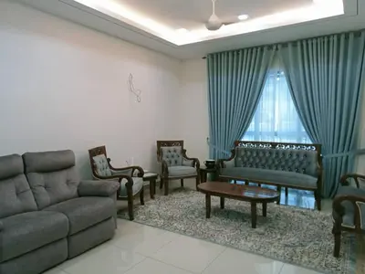 a living room with a couch and chairs and a window at MR OT HOMESTAY ( BAITUL RAUDHAH ) in Kepala Batas