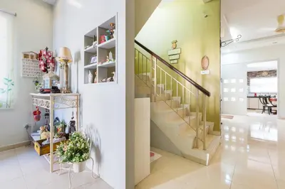 a hallway with a staircase and a stair case at Cosy HomeStay at Penang Island -Beach and Village in Bayan Lepas