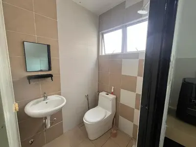 a bathroom with a toilet and a sink at MamaShy Homestay Manjung -FREE WIFI- in Seri Manjung