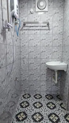 a bathroom with a shower and a sink at Santai Desa Chalet musleem 0nly in Brinchang