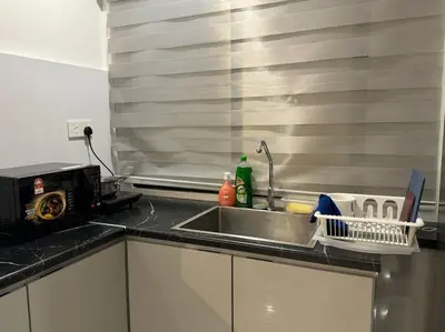 a kitchen counter top with a sink and a sink at 【NEW】Harmony’s Home@Juru Sentral Icon City in Bukit Mertajam