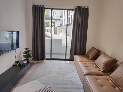 a living room with a couch and a large window at be.Paradise Duplex@The Cove-8mins to LWOT-12-14pax in Ipoh