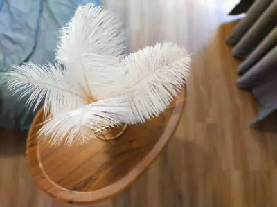 a bunch of white feathers sitting on a table at be.Paradise Duplex@The Cove-8mins to LWOT-12-14pax in Ipoh