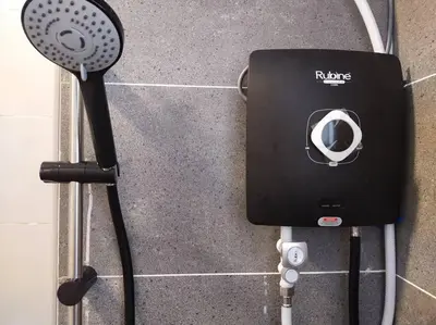 a fan and a hair dryer on a wall at be.Paradise Duplex@The Cove-8mins to LWOT-12-14pax in Ipoh