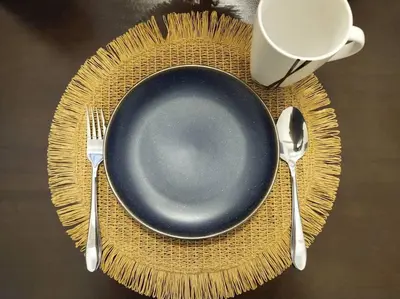 a plate with a fork and a cup on a table at be.Paradise Duplex@The Cove-8mins to LWOT-12-14pax in Ipoh