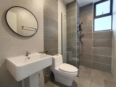 a bathroom with a sink and a toilet and a mirror at be.Paradise Duplex@The Cove-8mins to LWOT-12-14pax in Ipoh
