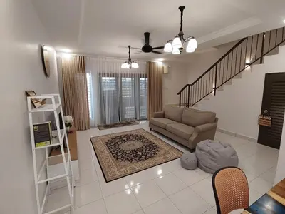 a living room with a couch and a staircase at Homestay in manjung pr1ma segari-Melayu only in Lumut