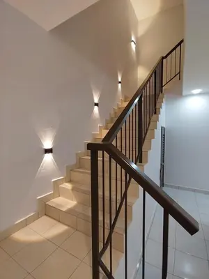 a staircase in a house with lights on the wall at Homestay in manjung pr1ma segari-Melayu only in Lumut