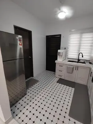 a kitchen with a refrigerator and a tiled floor at Homestay in manjung pr1ma segari-Melayu only in Lumut