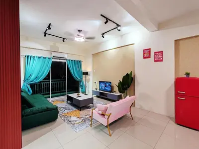 a living room with a green couch and a tv at Pavilionvillie M1T692 by irainbow in Ipoh