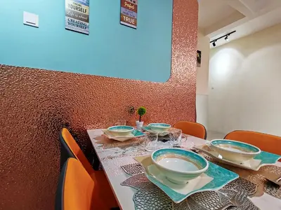 a table with bowls and plates on top at Pavilionvillie M1T692 by irainbow in Ipoh