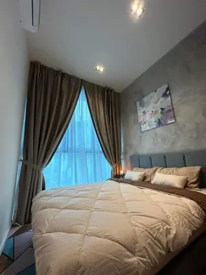 a bedroom with a large bed with a large window at coolvibes homes in Cameron Highlands