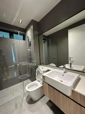 a bathroom with a toilet and a sink and a shower at coolvibes homes in Cameron Highlands