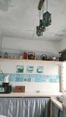 a kitchen with blue and white tiles on the wall at Kitty Home Near to Penang Hill in Ayer Itam