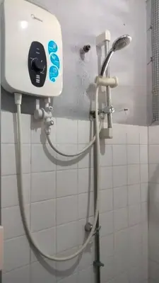a shower in a bathroom with a shower head at Kitty Home Near to Penang Hill in Ayer Itam