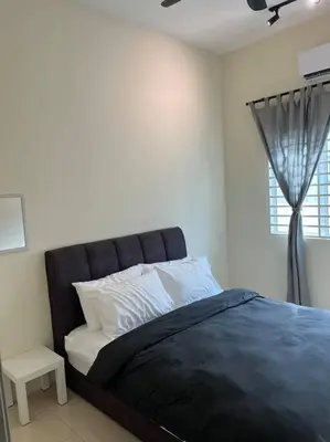 a bedroom with a black bed with a window at Double Seven Eight Homestay SemiD at Bandar Baru Setia Awan Perdana in Sitiawan
