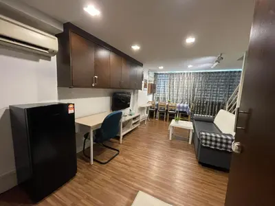 a living room with a kitchen and a dining room at CEOZ2 Duplex 2BR Suite #Airport #USM #SPICE #Pantai in Bayan Lepas