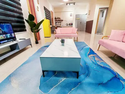 a living room with a table on a blue carpet at Pavilionvillie M1T694 by irainbow in Ipoh