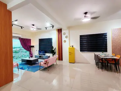 a living room with a table and a dining room at Pavilionvillie M1T694 by irainbow in Ipoh