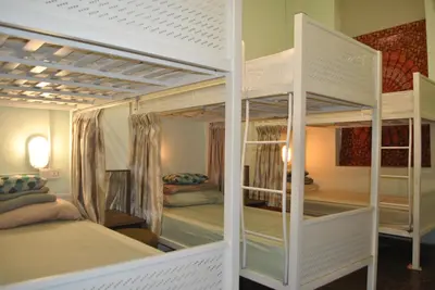 a room with two bunk beds in a room at Rope Walk Guest House in George Town