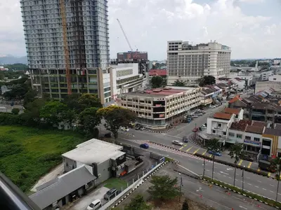an aerial view of a city with buildings and a street at Tower Homestay @ Muslim Friendly in Ipoh