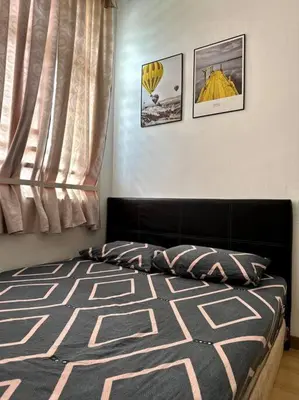 a bedroom with a bed and a window at D' Permata Homestay Kulim in Kulim
