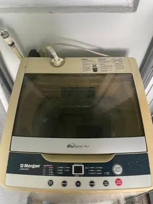 a microwave oven sitting on top of a wall at D' Permata Homestay Kulim in Kulim