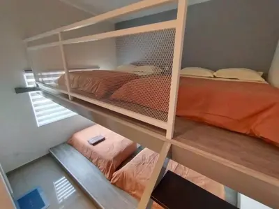 a bedroom with two bunk beds and a bed at Morning de Ville-Private Pool BBQ Karaoke 26-30pax in Ipoh