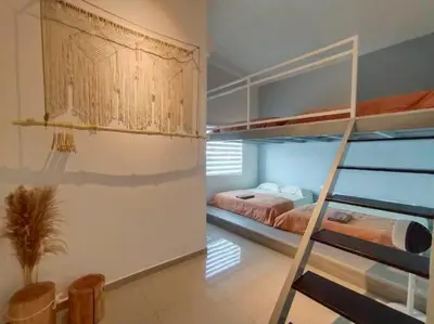 a bedroom with two bunk beds and a staircase at Morning de Ville-Private Pool BBQ Karaoke 26-30pax in Ipoh