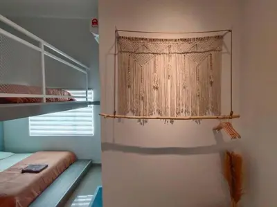 a bedroom with a bunk bed and a curtain at Morning de Ville-Private Pool BBQ Karaoke 26-30pax in Ipoh
