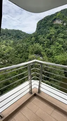 a balcony with a view of a mountain at Ipoh Tambun Private Unit Lakeside Residences in Kampong Batu Lapan