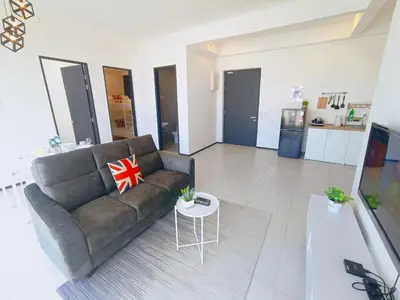 a living room with a couch and a table at Infinity Pool, Georgetown, Up to 11 Pax, 3 Bedrooms, 2 Bathrooms, 2 Car Parks by Star Home in Jelutong