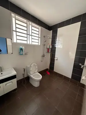 a bathroom with a toilet and a sink and a shower at DOUBLE EE HOMESTAY 6 cars parking place 12pax in Sitiawan