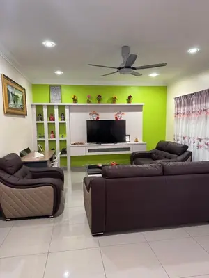 a living room with two couches and a flat screen tv at DOUBLE EE HOMESTAY 6 cars parking place 12pax in Sitiawan