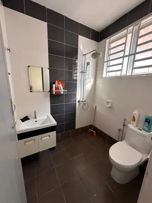 a bathroom with a toilet and a sink at DOUBLE EE HOMESTAY 6 cars parking place 12pax in Sitiawan