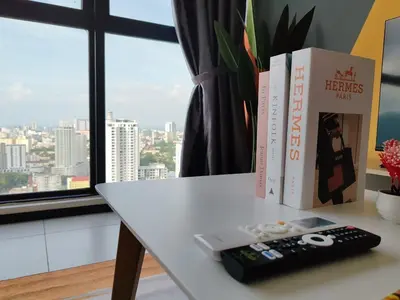 two books and a remote control on a table at Urban Simplicity Suite, 5 Pax, 2 Car Parks at Urban Suites Georgetown by SuperStay in Jelutong