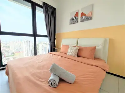 a bedroom with a large bed with a large window at Urban Simplicity Suite, 5 Pax, 2 Car Parks at Urban Suites Georgetown by SuperStay in Jelutong