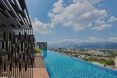 a swimming pool on the side of a building at Cozy Urban Retreat @ Horizon in Ipoh