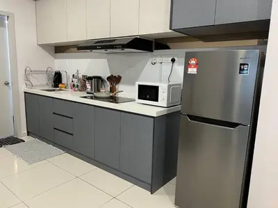 a kitchen with a stainless steel refrigerator and a microwave at Cozy Urban Retreat @ Horizon in Ipoh