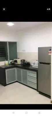 a kitchen with a refrigerator and a sink at 288 Sekinchan Coze Home in Sekincan