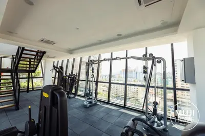 a gym with cardio equipment in a building at MUJI X Rilakkuma Seaview 3BR Georgetown with TV Box in Jelutong