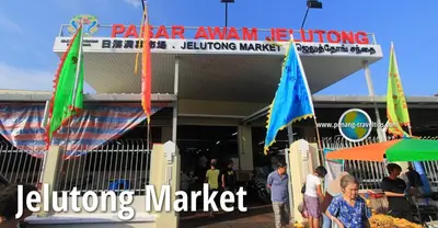 a group of people standing outside of a building with flags at MUJI X Rilakkuma Seaview 3BR Georgetown with TV Box in Jelutong