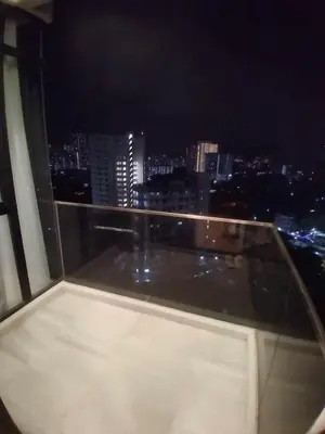 a room with a view of a city at night at Rooftop - Sky Pool - 2BR Premium Homestay - Georgetown \u57ce\u5e02 6 pax in George Town