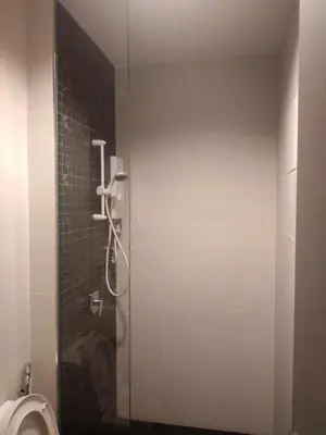 a bathroom with a shower stall with a toilet at Rooftop - Sky Pool - 2BR Premium Homestay - Georgetown \u57ce\u5e02 6 pax in George Town
