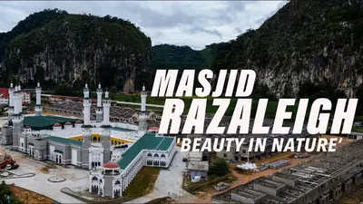 a model of a mosque with a mountain in the background at Putra 2 Homestay in Gua Musang