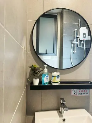 a bathroom with a mirror and a sink at ASC Smart Urban Suite Jelutong 2BR 3BR in Jelutong