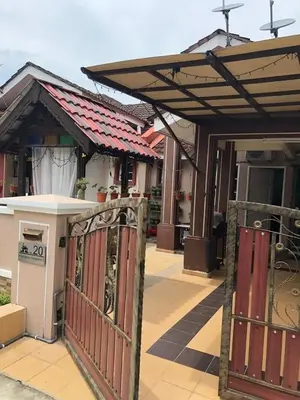 an entrance to a house with an open gate at zam homestay kulim perdana hitech utk Msliim shj in Kulim