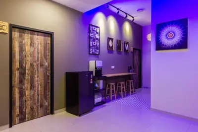 a bar in a restaurant with purple lighting at Newly 5BR Cottage House Retreats (Free Parking) in Butterworth